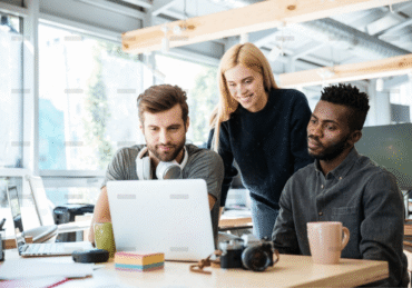 demo-attachment-888-happy-colleagues-sitting-in-office-coworking-PHYA6TG
